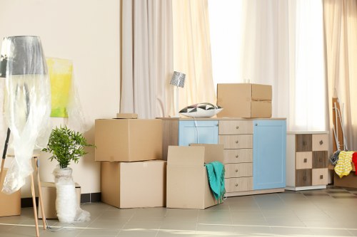 Team member loading items safely into a van during a move