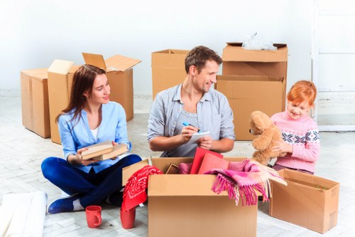 Moving boxes and household items prepared for transport in Maida Vale